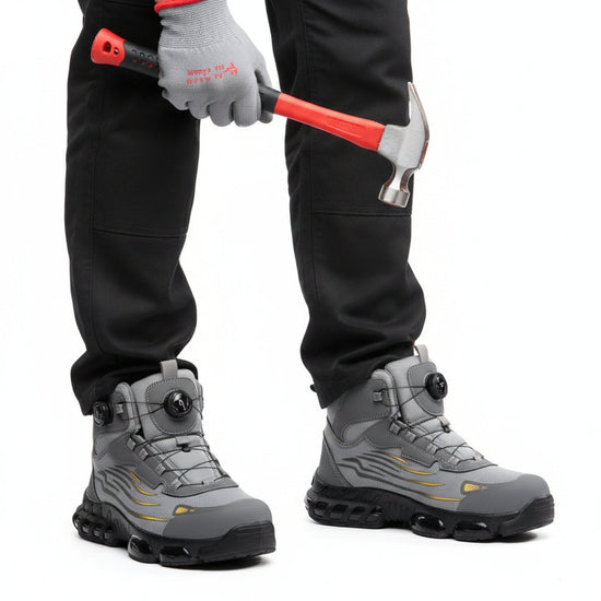 RewanPro Z91 – zimowe buty robocze S1P, szare, scena robocza z młotkiem